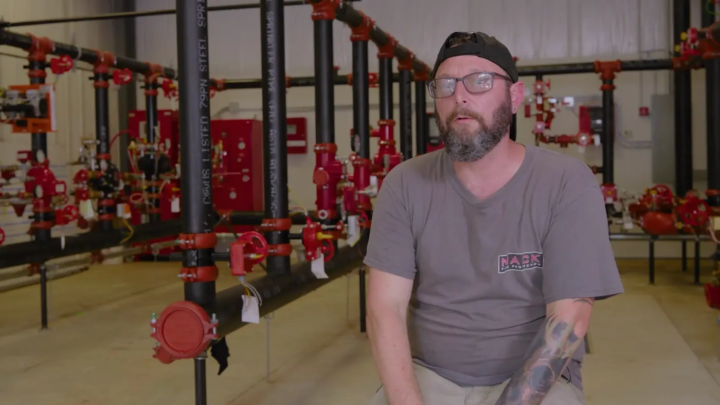 Kevin Griswald of Mack Fire Protection in a sprinkler riser room